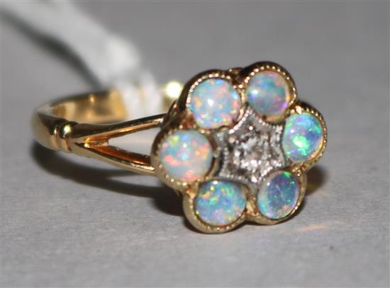 An 18ct gold opal and diamond ring